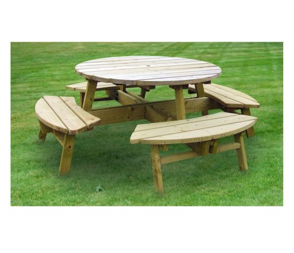 Round Wooden Picnic Table On Grass