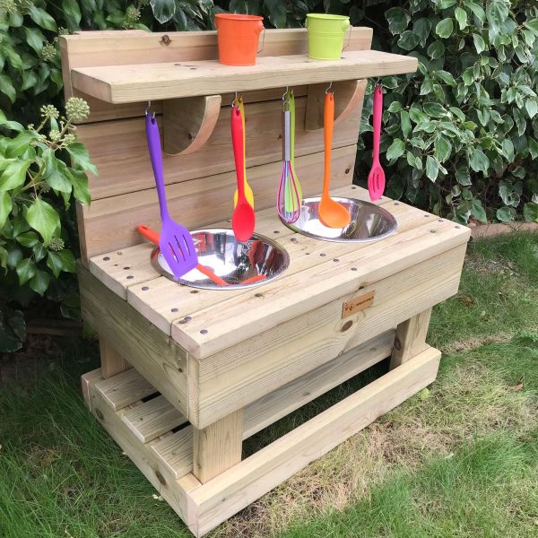 Side View Of Small Wooden Mud Kitchen