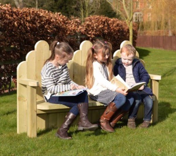 Children Sitting On Wooden Story Bench