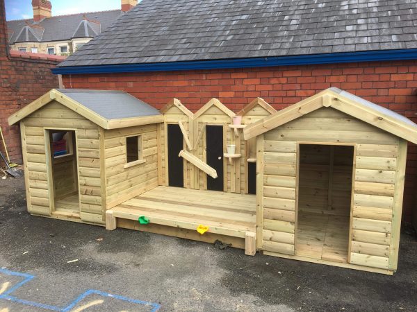 Wooden Playhouse In Playground